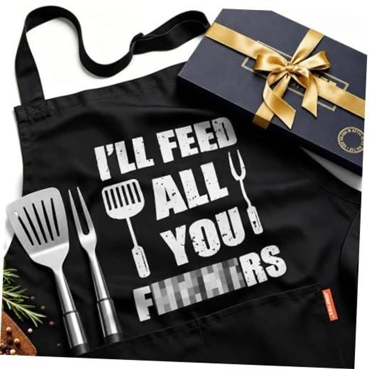 Black cooking apron with bold white slogan and utensil icons