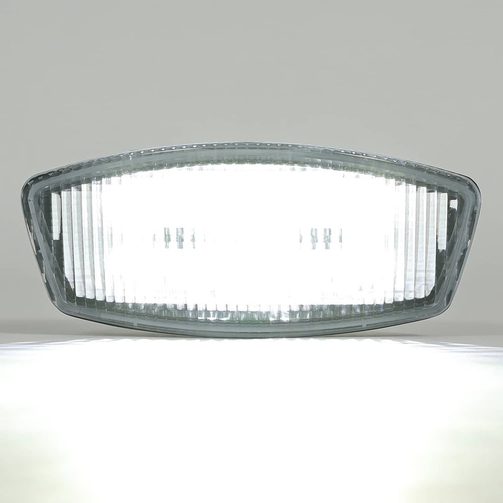 LED cab roof marker light with clear oval front lens and dark ventilated housing
