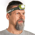 Foxelli LED headlamp on khaki strap, clear front lens with white LED light