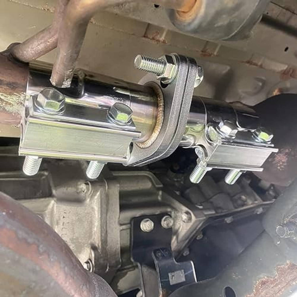 Exhaust flange repair piping kit clamped to exhaust tubing with gasket and nuts.