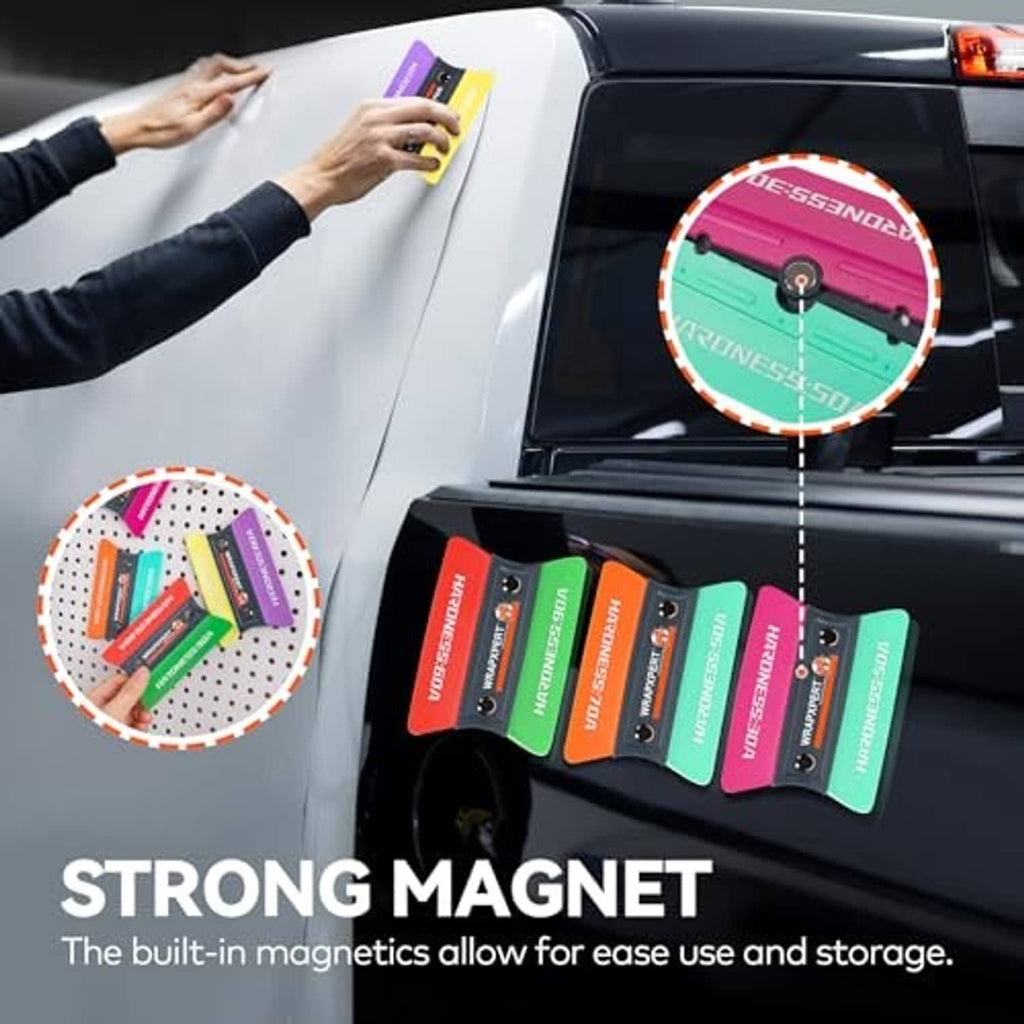 Magnetic vinyl wrap felt squeegee on a car window with several colorful squeegees nearby