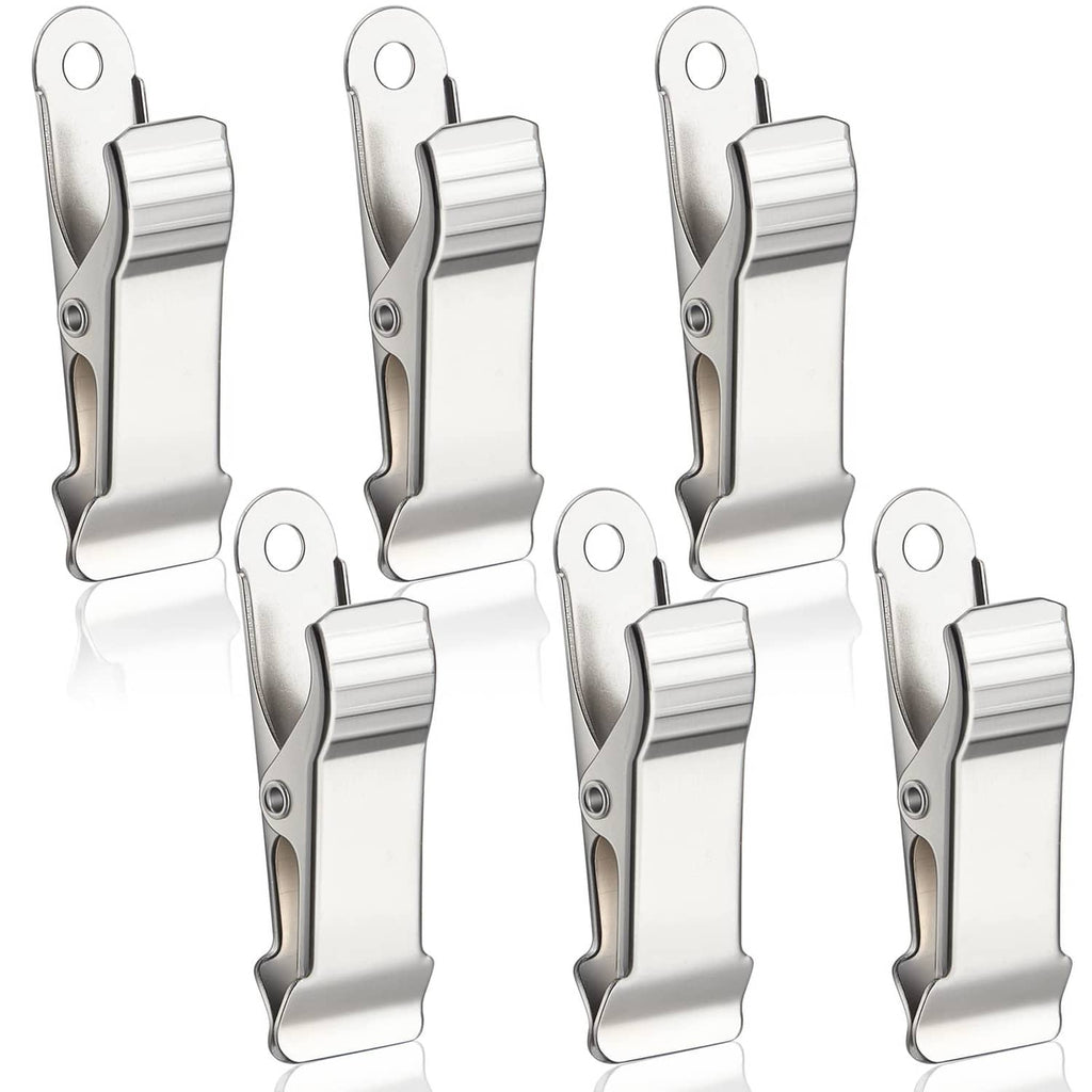 Set of silver metal mini crocodile spring clamps with alligator-style jaws