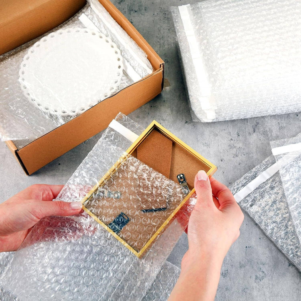 Self-seal bubble cushion mailer bag wrapping a phone and inside packaging