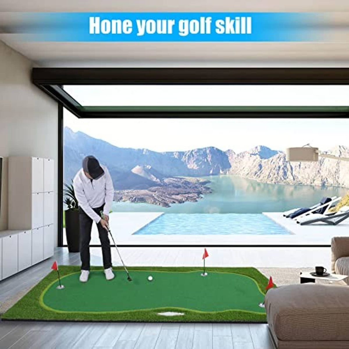 Green golf putting green mat set up indoors with red flags and white golf ball