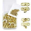Antique gold jewelry box latch and hinge hardware with mounting screws in plastic case