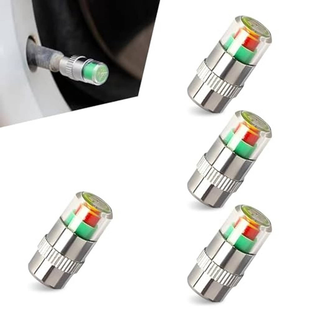 Four silver tire valve stem caps with green, red, and yellow indicator window