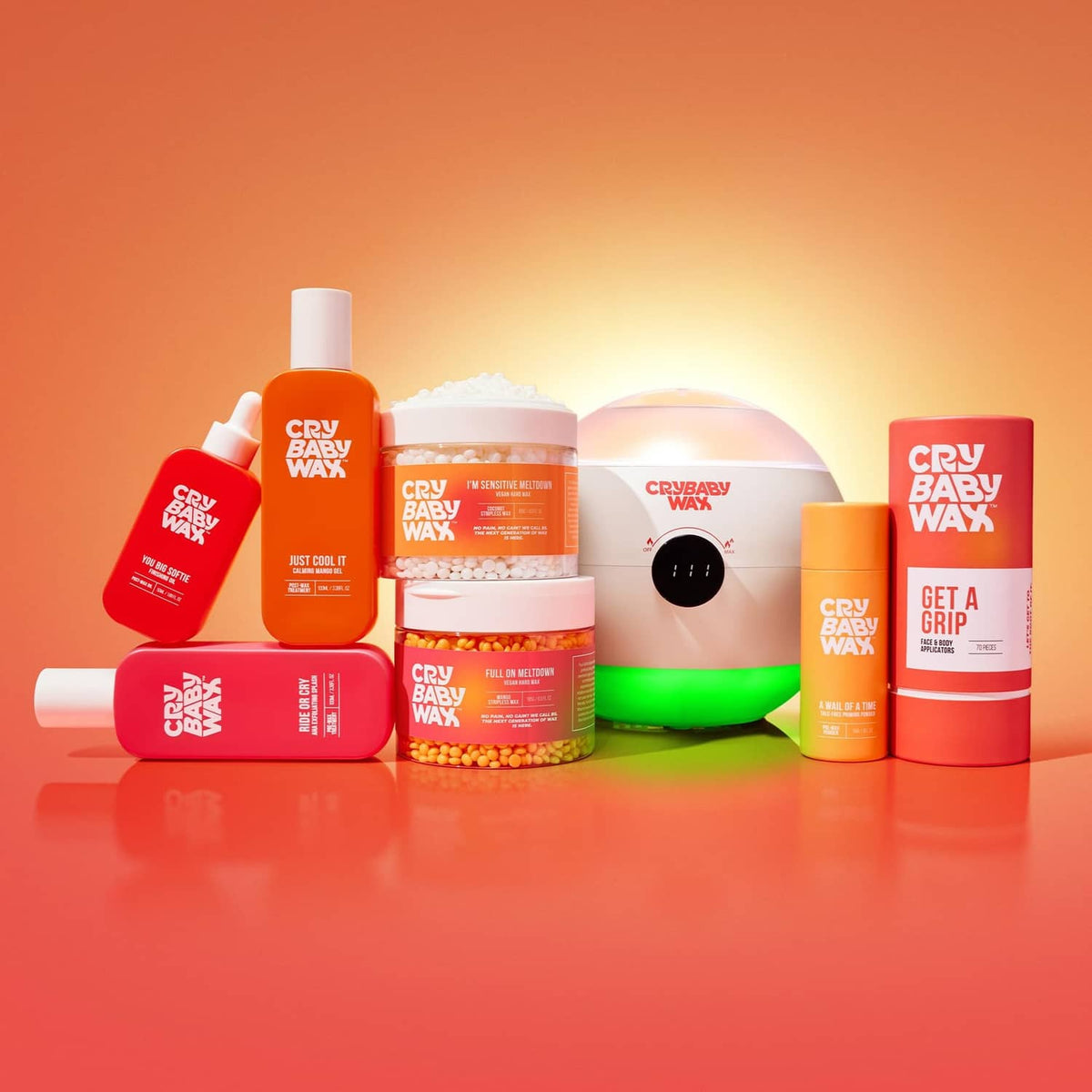 Cry Baby Wax skincare product lineup with multiple pink bottles and a jar