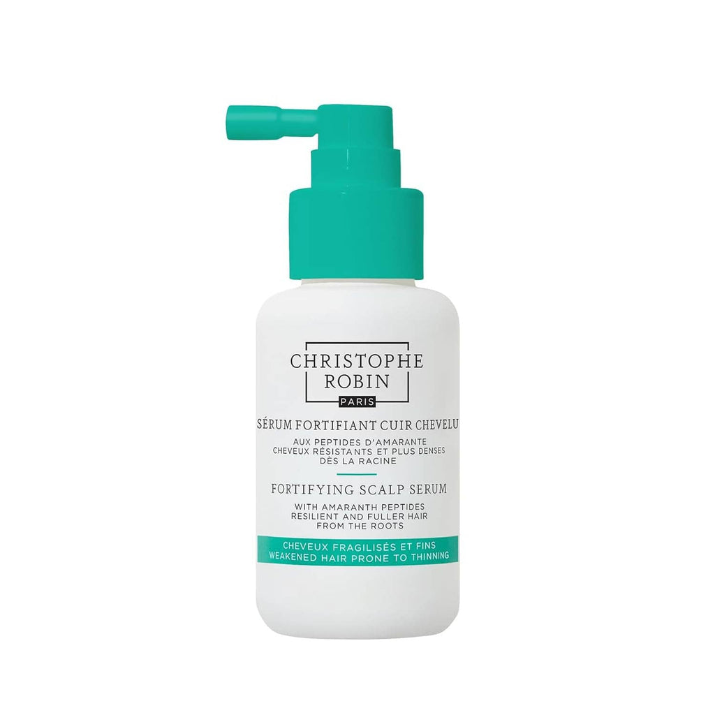Fortifying scalp serum bottle with teal pump and white bottle for hair care