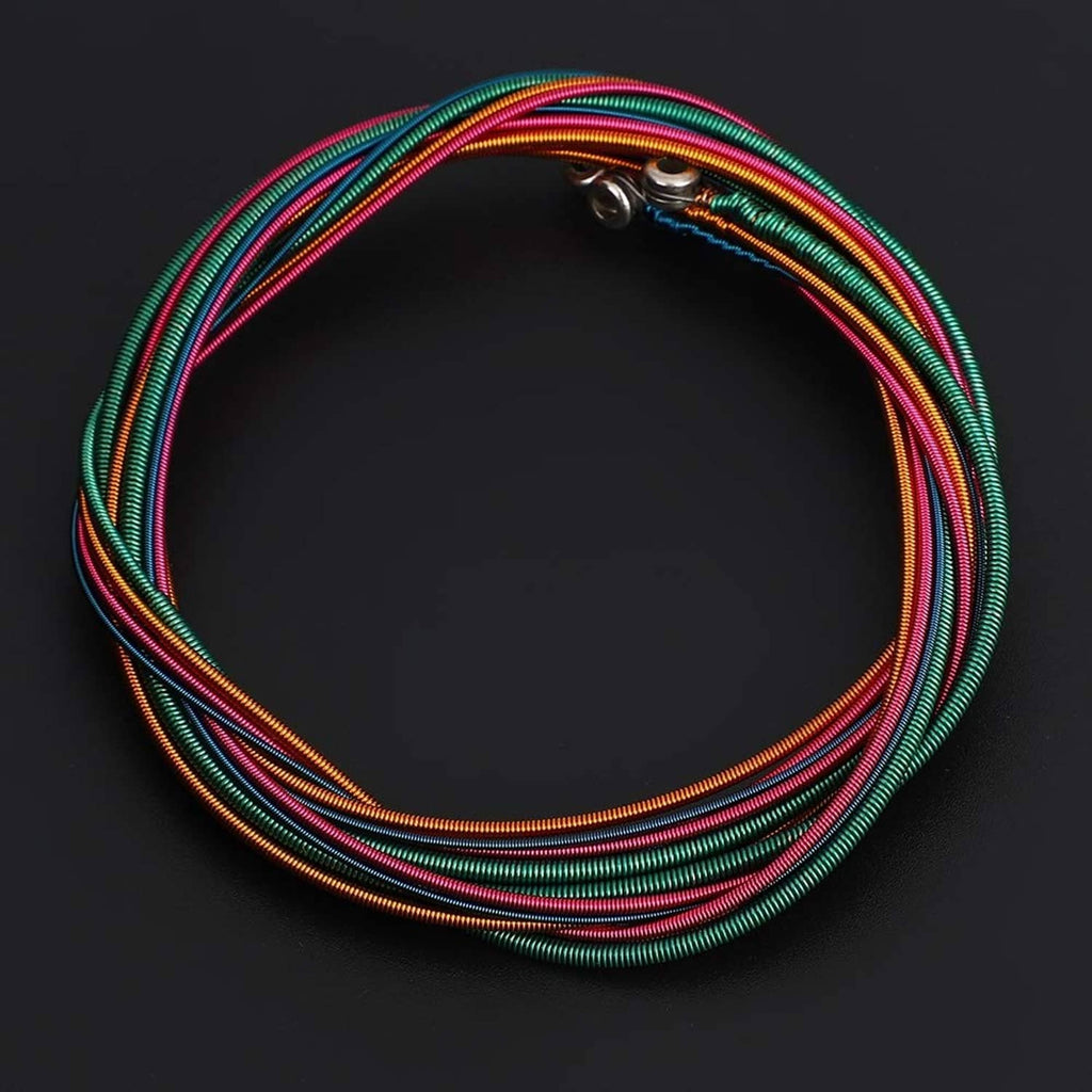 Teal, gold, and multicolor coiled steel bass strings with silver metal end fitting