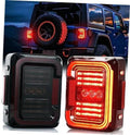 Pair of LED Jeep taillights with smoke lens, black housing and red glowing light bars