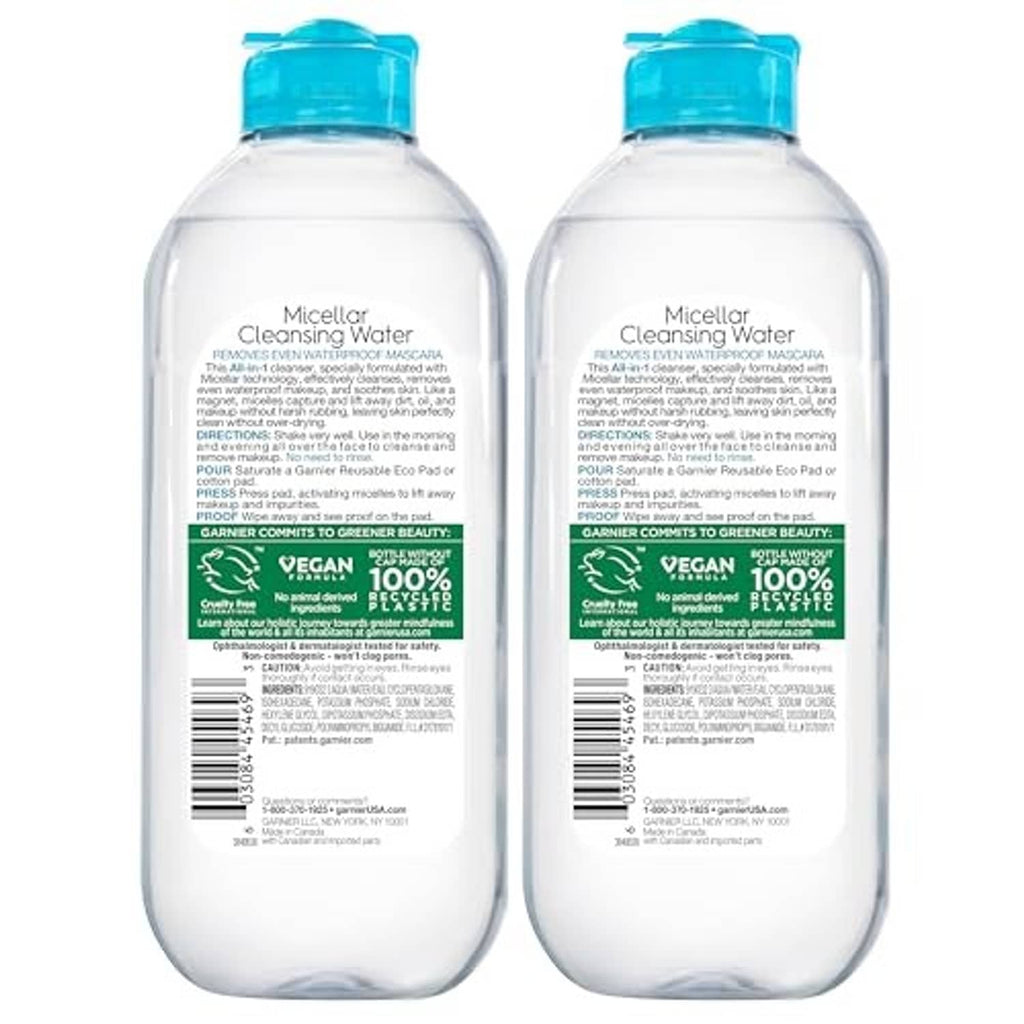 Two Garnier SkinActive micellar cleansing water bottles showing back labels, blue caps.