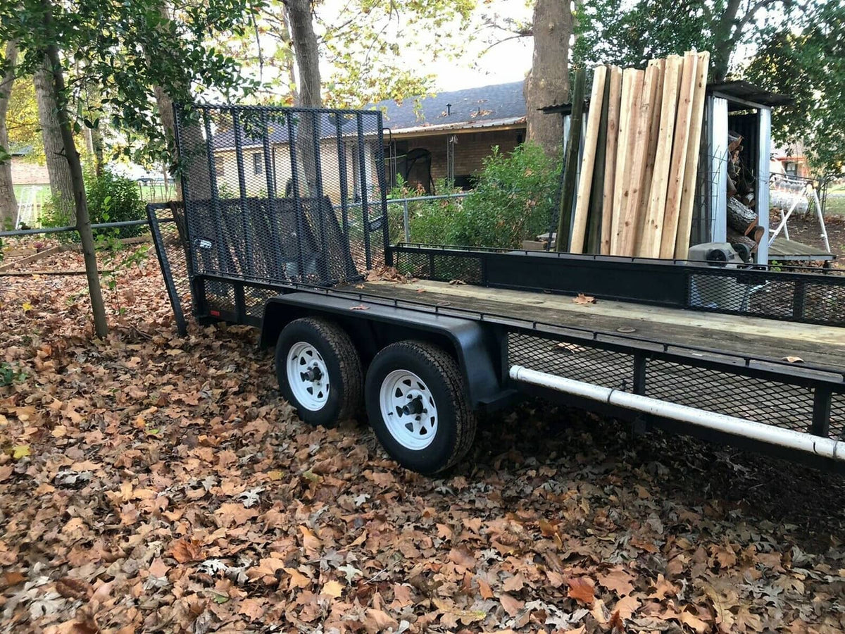 Tandem axle steel diamond tread trailer fenders mounted on a utility trailer