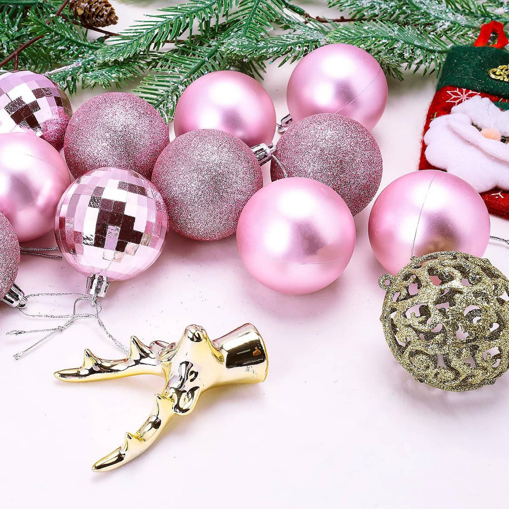 Assorted pink Christmas ornament balls with glitter, mirror shine, and patterned caps