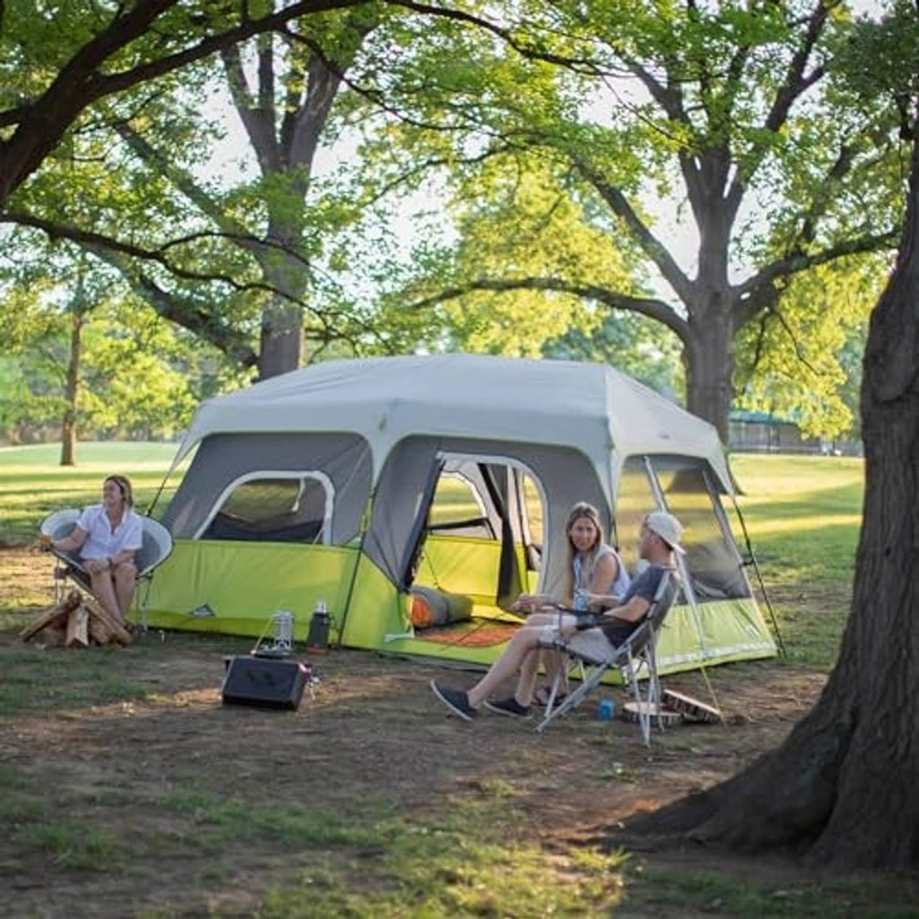 9-person instant cabin tent with green sides and gray windows set up outdoors