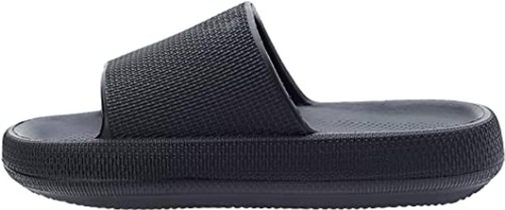 Black pillow slide slippers, side view with textured strap and thick rubber sole.