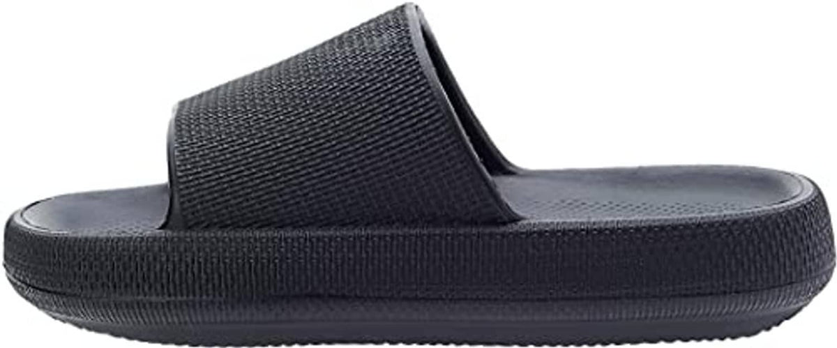 Black pillow slide slippers, side view with textured strap and thick rubber sole.