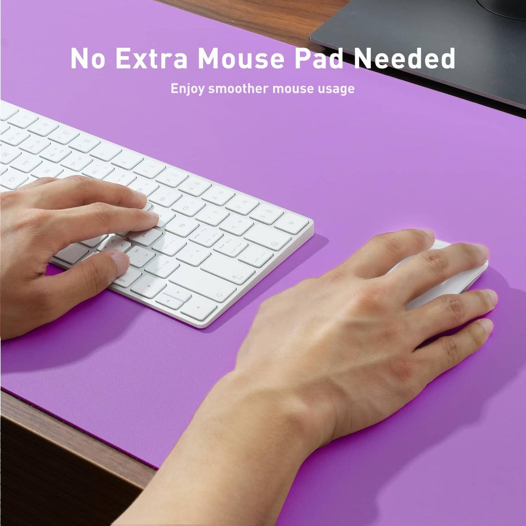Purple desk pad protector under keyboard and hand use