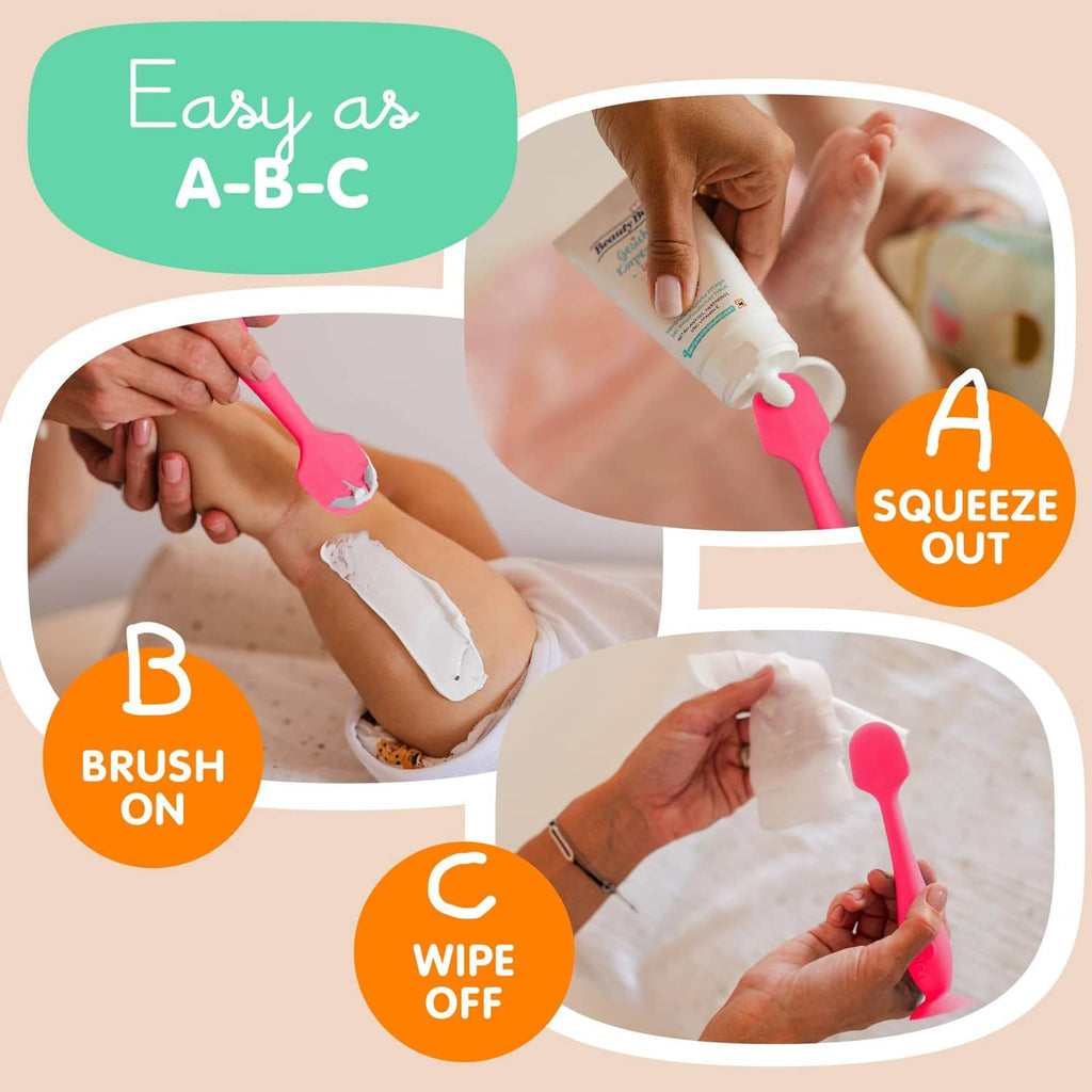 Pink baby bum brush with suction base and soft silicone head for cleaning