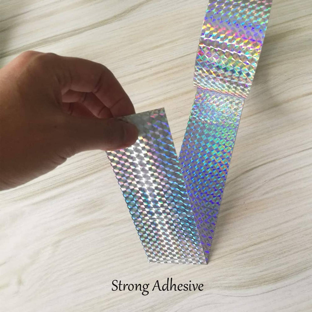 Eacilles holographic reflective tape strip being applied by hand, rainbow diamond pattern
