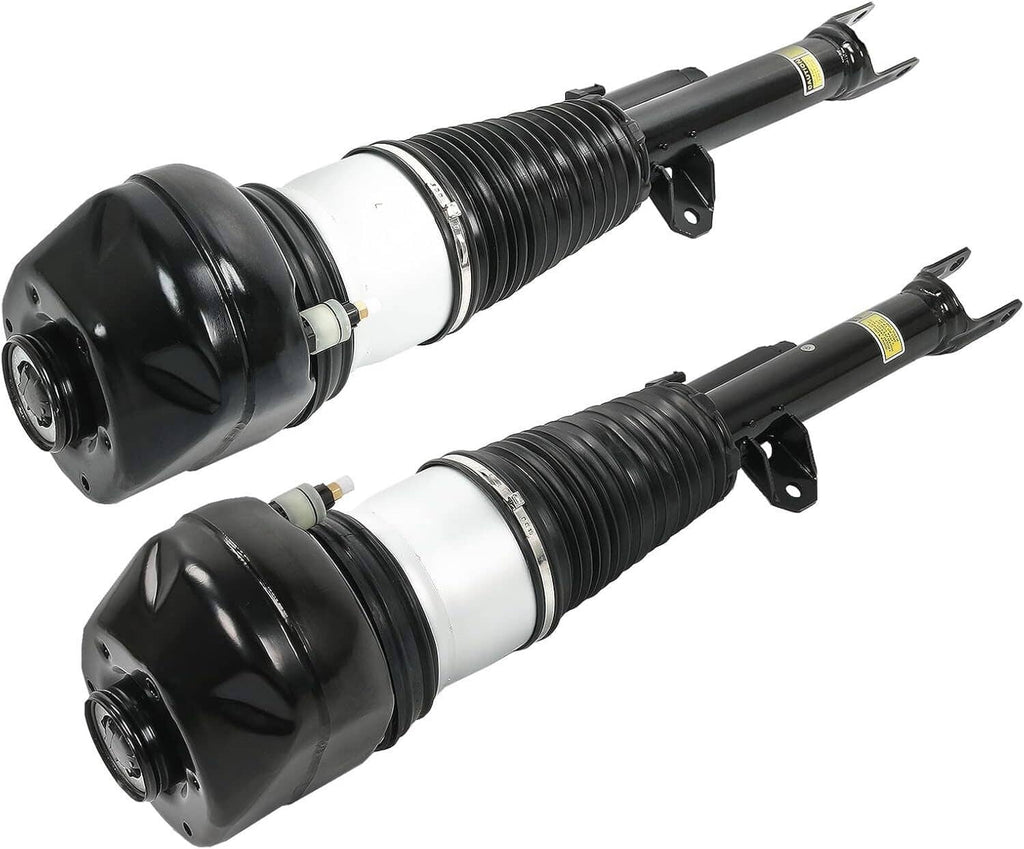 Pair front air suspension struts, side-by-side black caps and white air cylinders