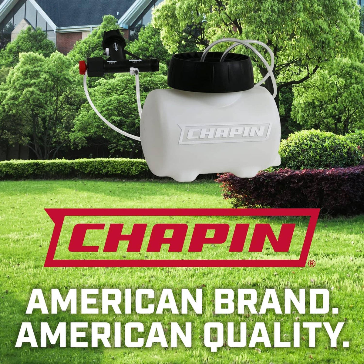Chapin Hydrofeed injection tank on outdoor lawn with attached hoses and black top