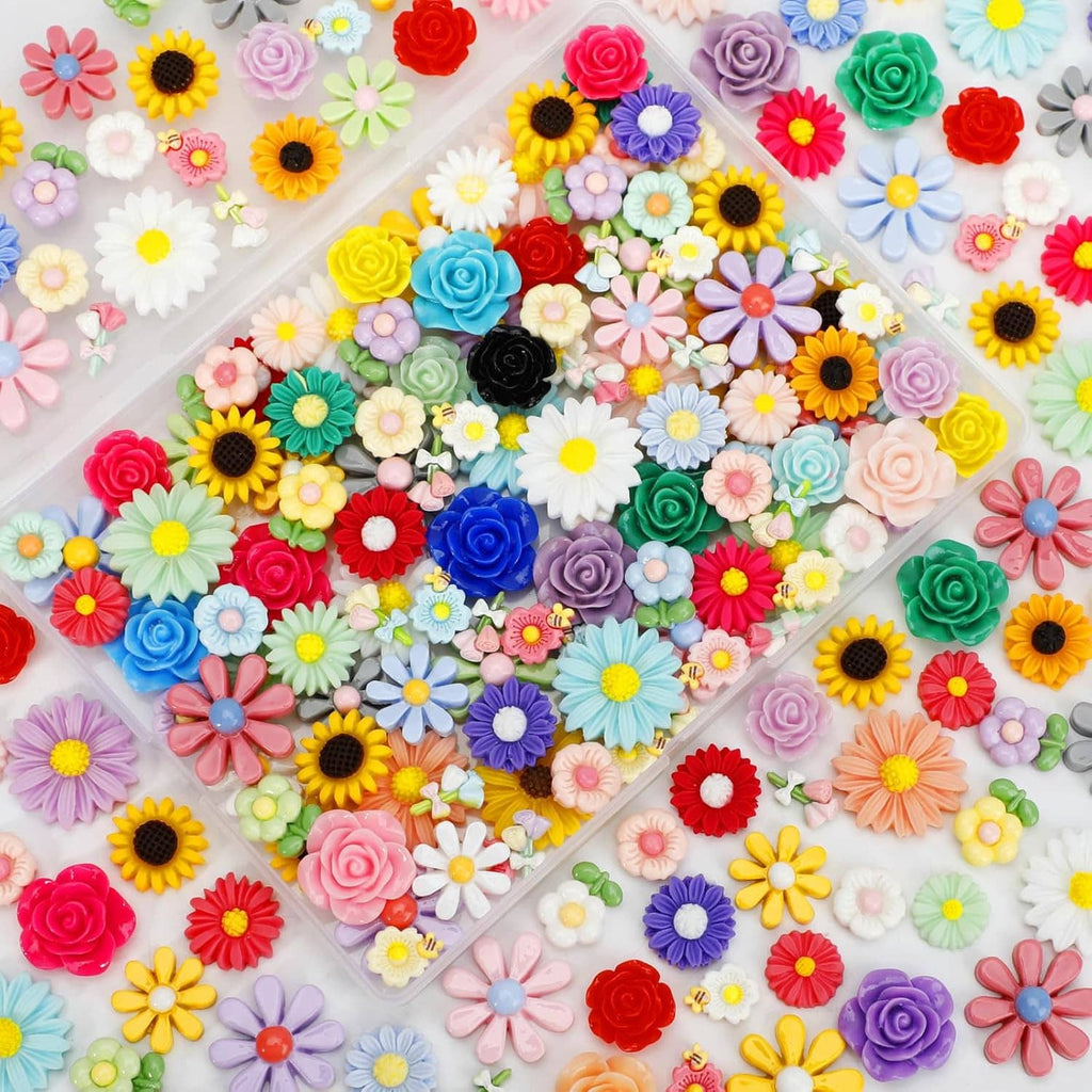 Large spread of assorted mini flatback resin flowers in many bright colors