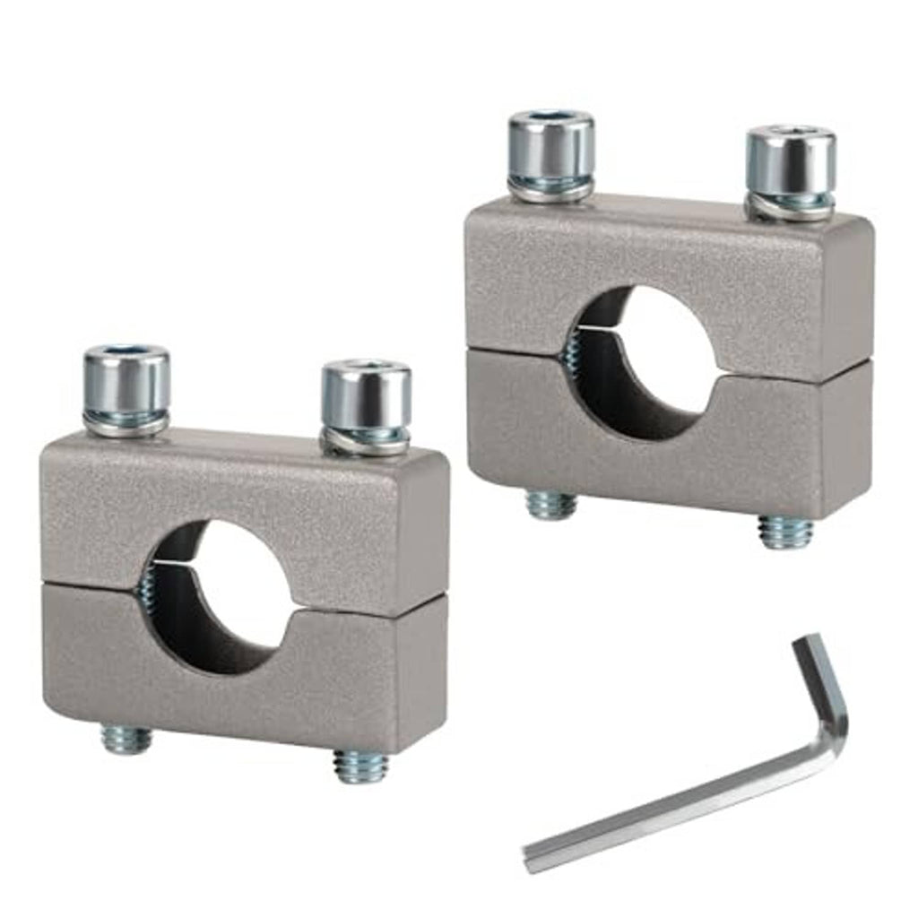 Pair of silver handlebar clamp risers, each with center hole and two mounting bolts