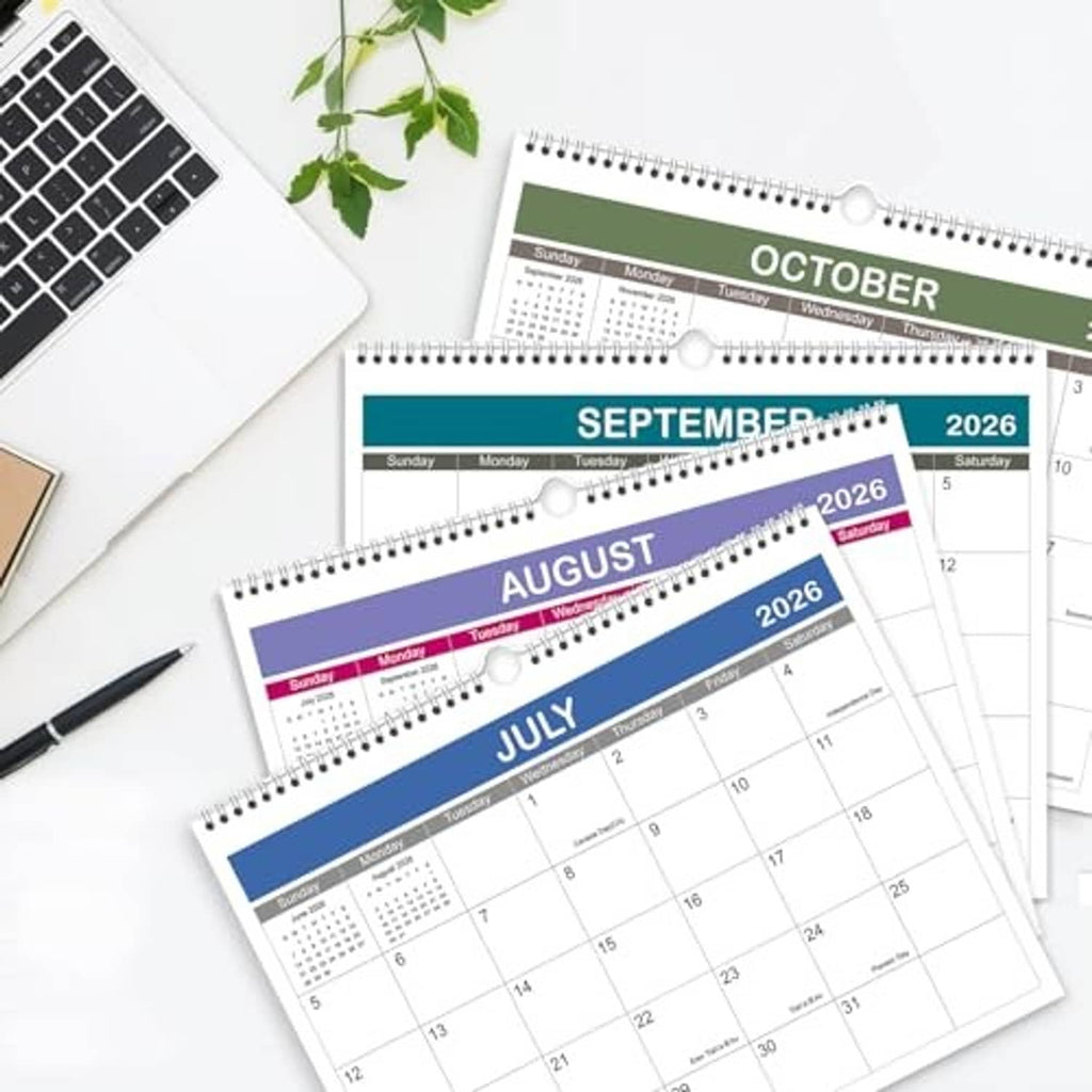 Spiral wall calendar showing July–October 2026 pages with deep blue headers and date grids.