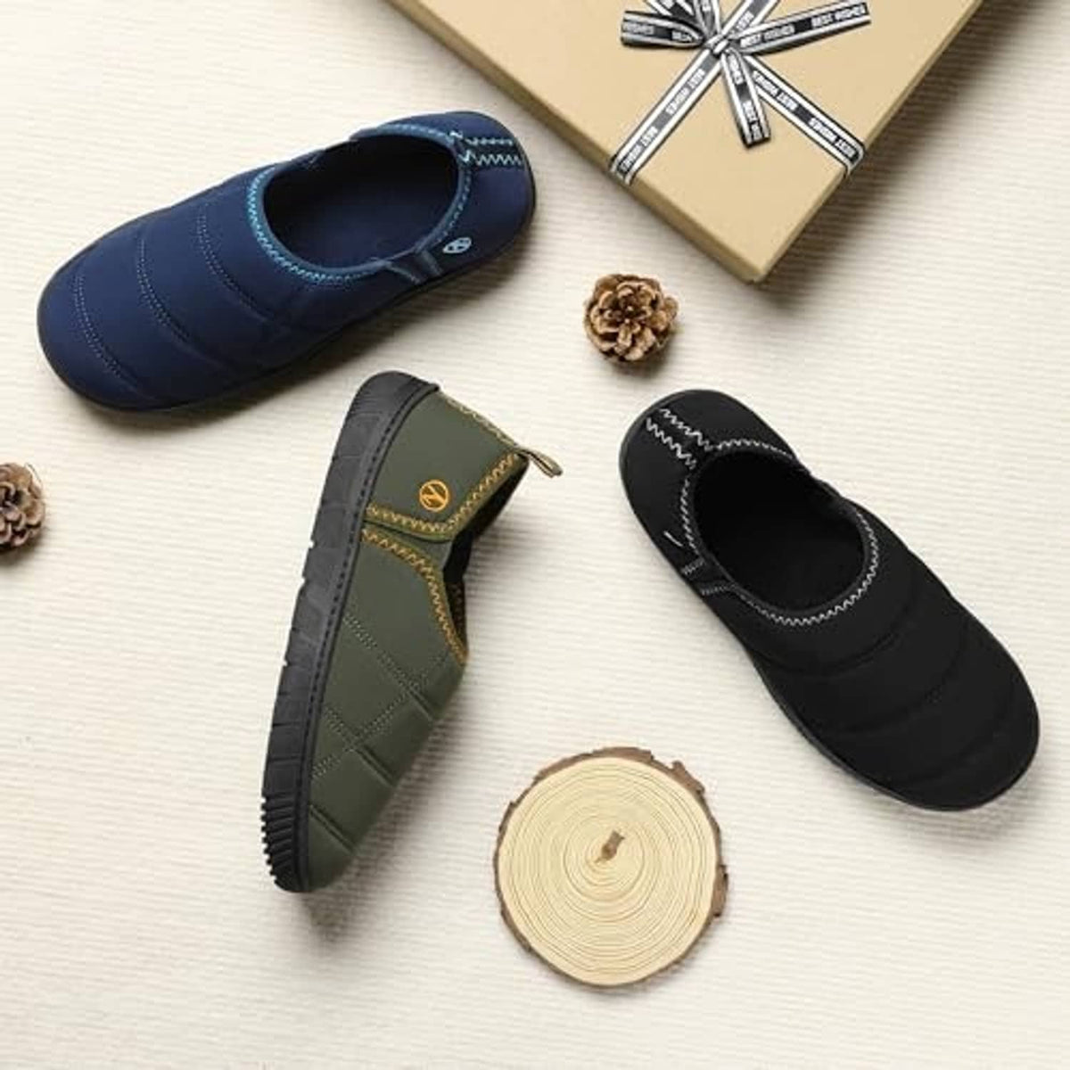 Blue slip-on slipper with soft interior opening and cushioned sole for indoor use