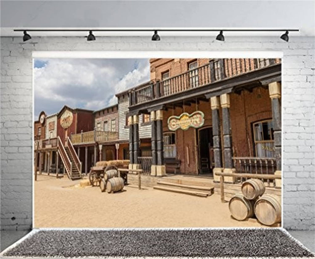 Western scenic photo backdrop with brick storefronts, porch rails, and barrel display