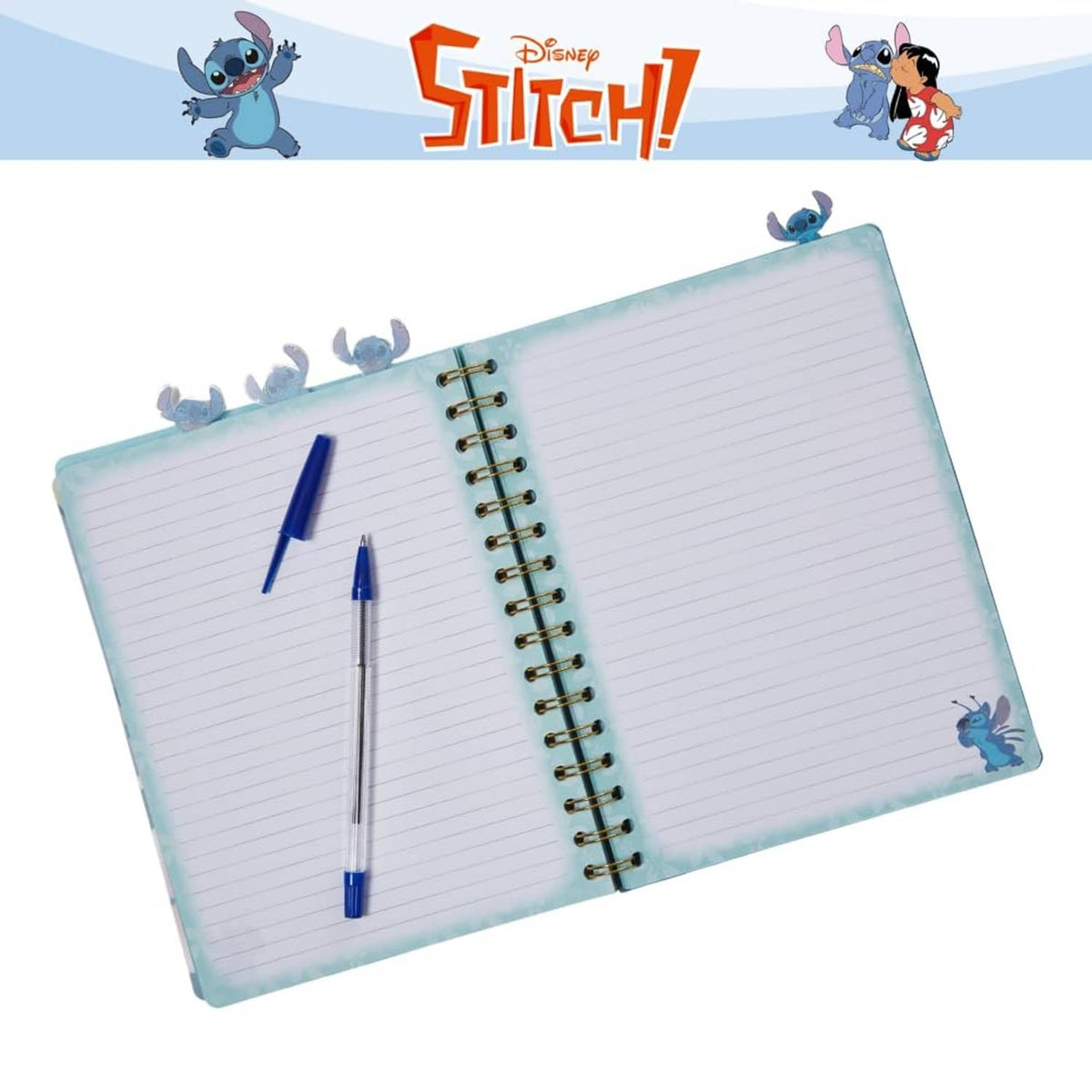 Lilo & Stitch spiral notebook opened to lined pages with two blue pens