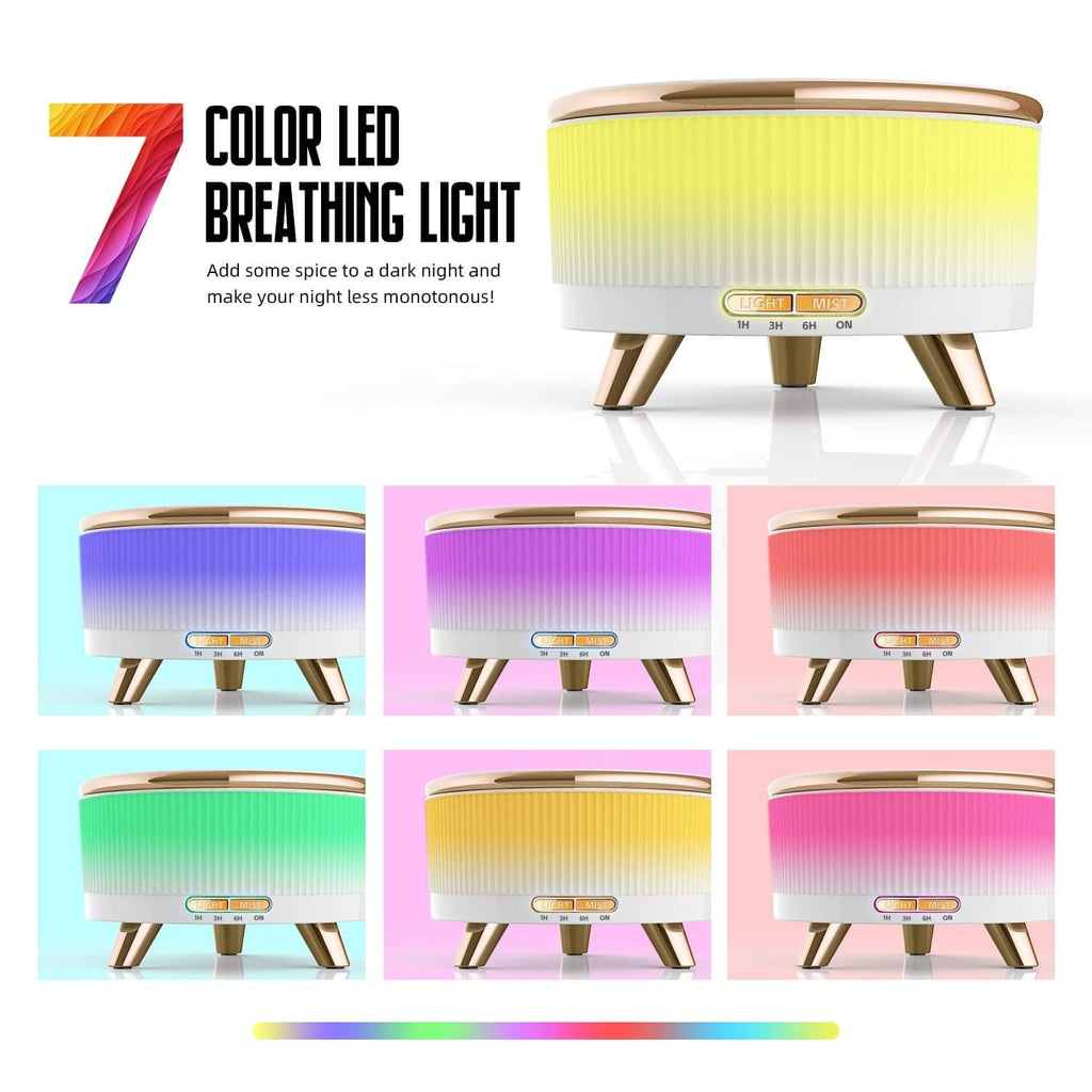 White essential oil diffuser with gold feet and green-yellow LED light top