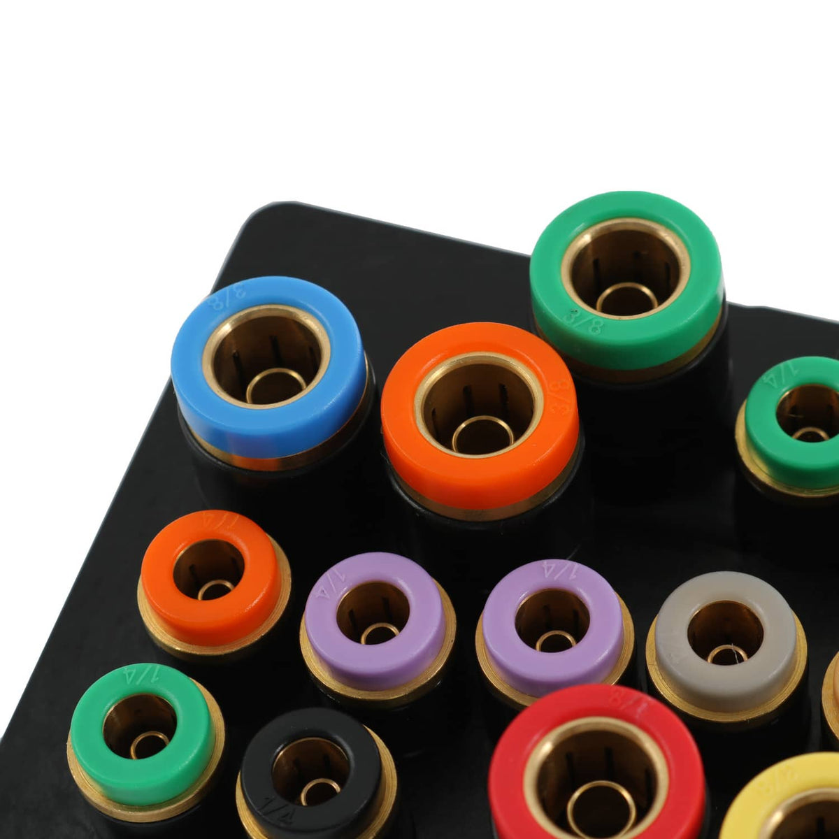 Air manifold top view with orange, blue, green, and red fittings on black plate