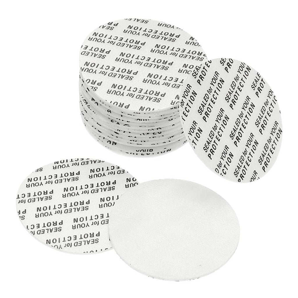 White 35mm foam lid liner discs, stacked and loose for sealing