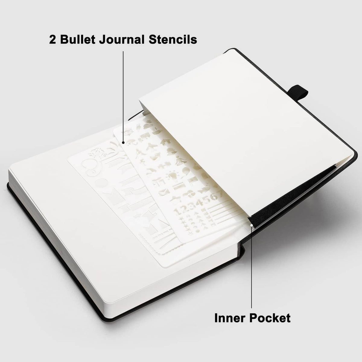 Bullet journal notebook open showing inner pocket and two bullet journal stencils