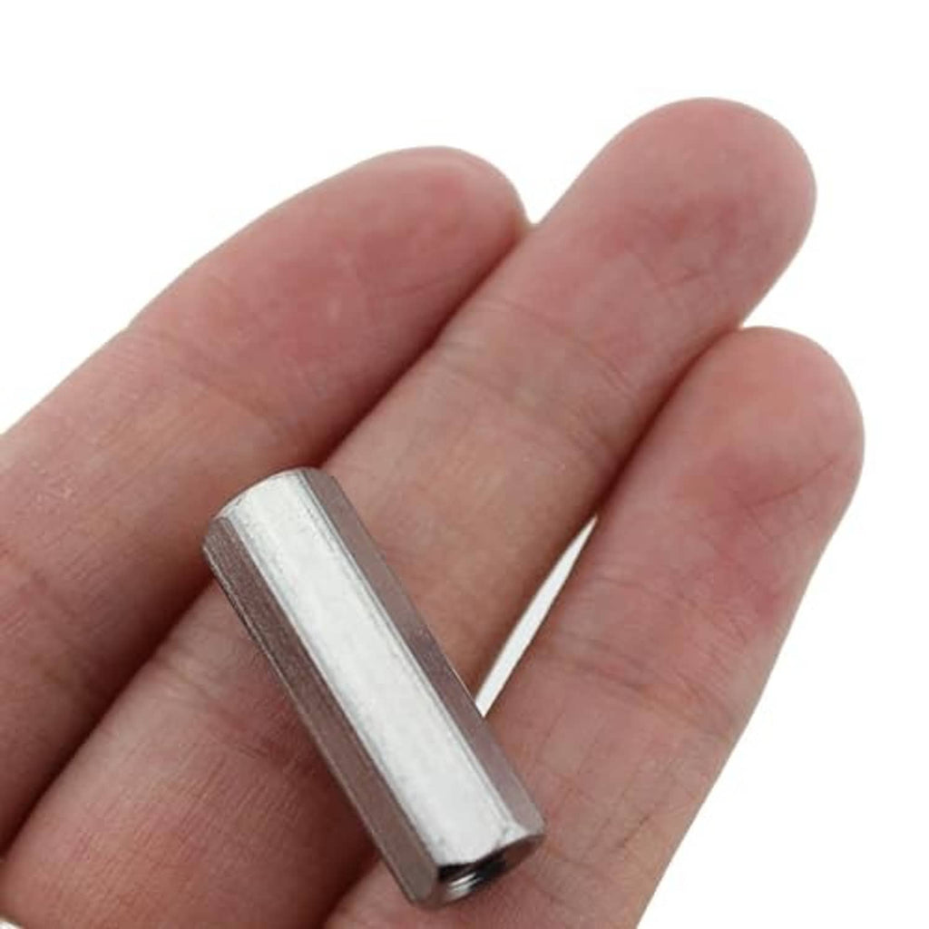 304 stainless steel M5x25 hex socket screw held in hand, silver metal