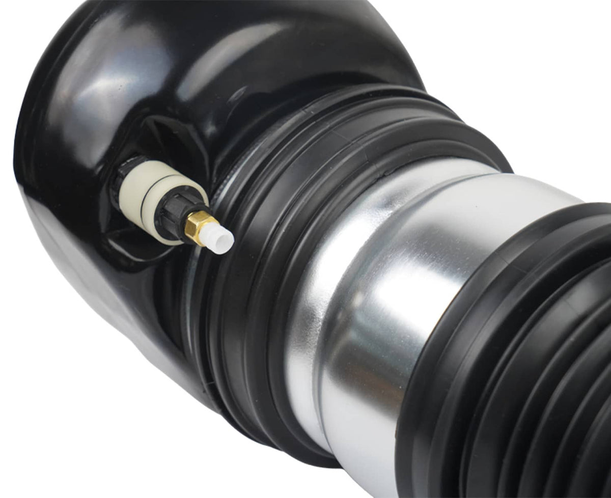 Close-up of black air strut cap and silver cylinder with wiring sensor plug