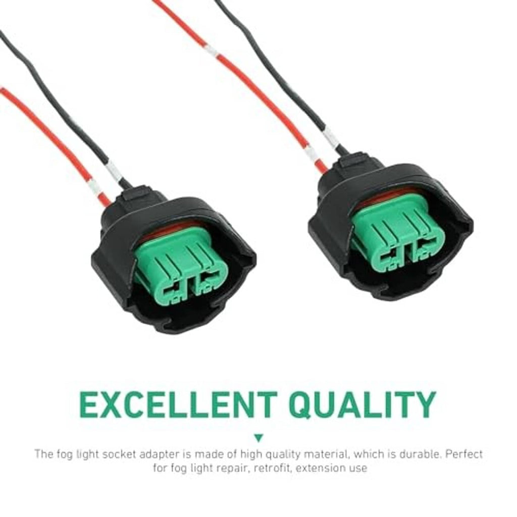 Two female fog light harness connectors, black housings and green inserts with red/black wires