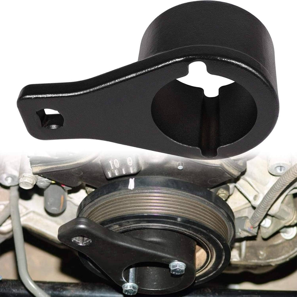 Black harmonic damper pulley holding tool installed over crankshaft pulley