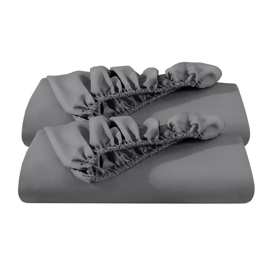 Grey fitted sheet set folded with gathered elastic edges
