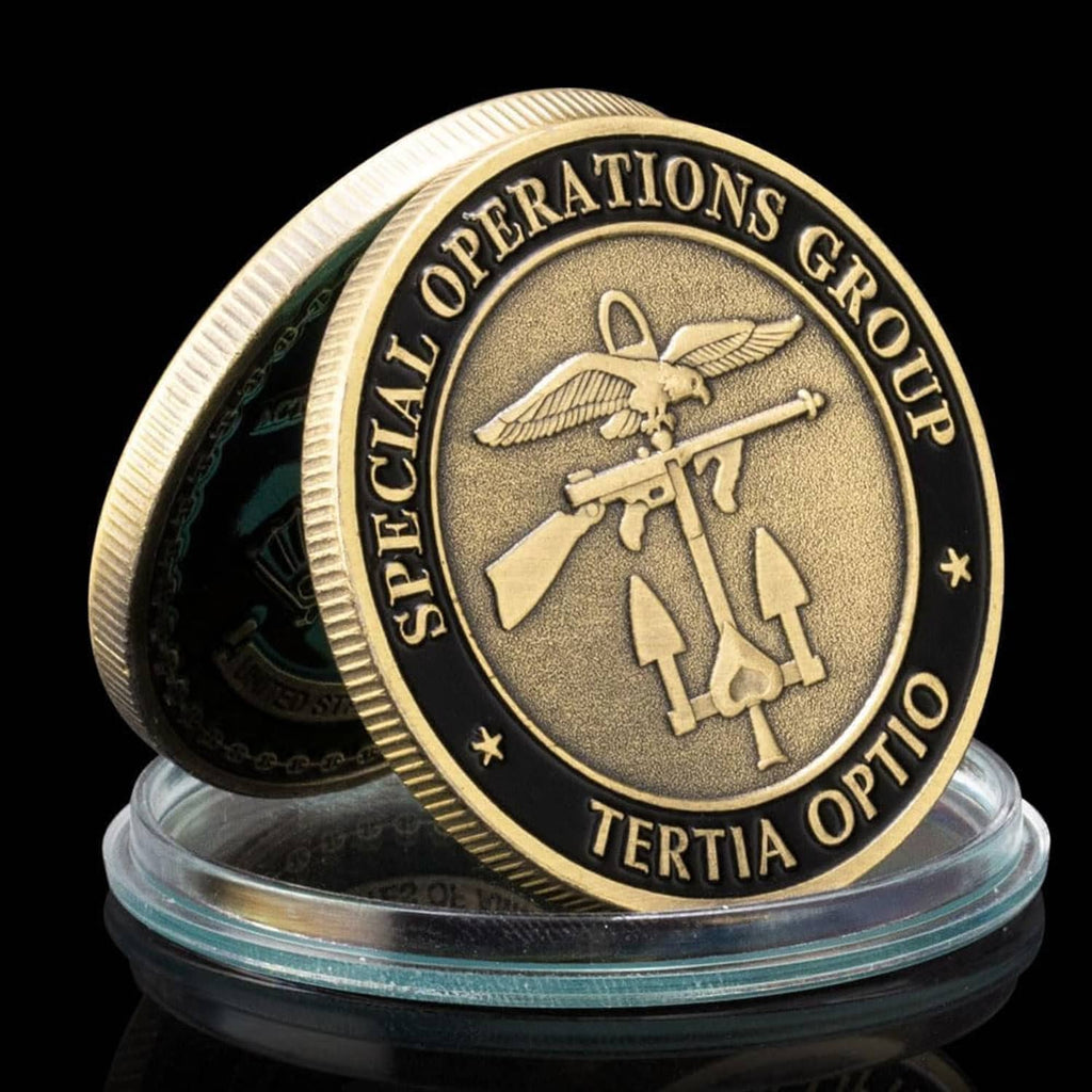 Dark military challenge award coin on clear stand base, winged eagle and rifle design