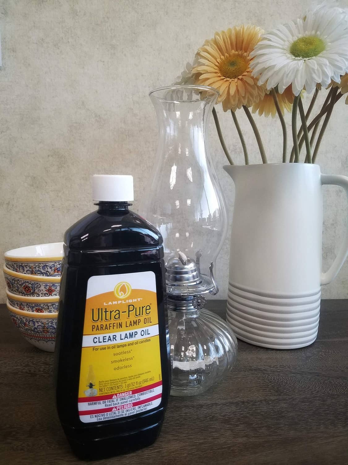 Lamplight ultra-pure clear lamp oil bottle with white cap and yellow label