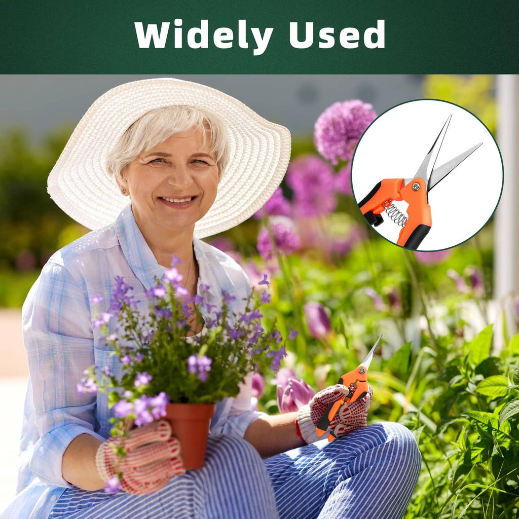 Orange stainless-steel garden shears held by a gardener for pruning plants
