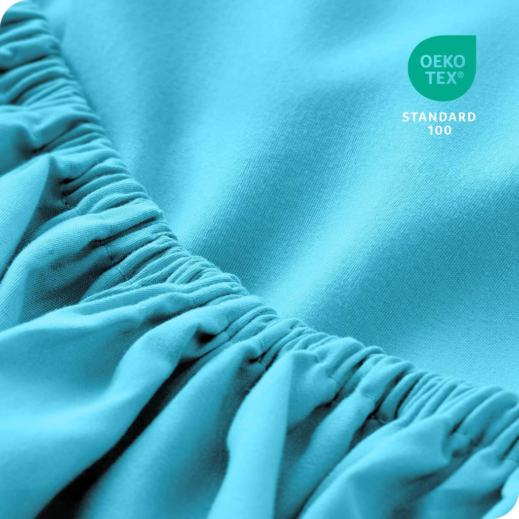 Aqua microfiber fitted sheet close-up with gathered elastic edge detail