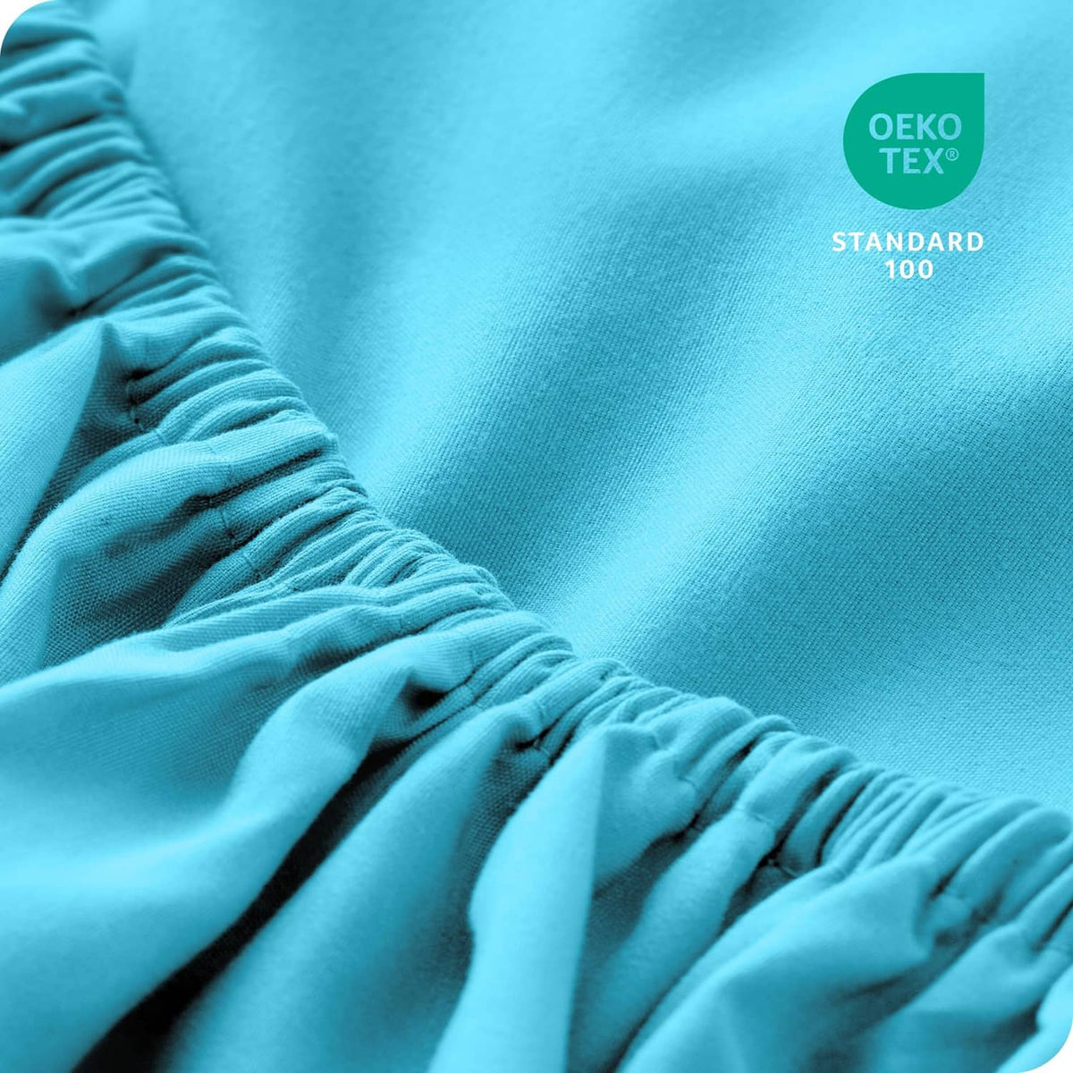 Aqua microfiber fitted sheet close-up with gathered elastic edge detail