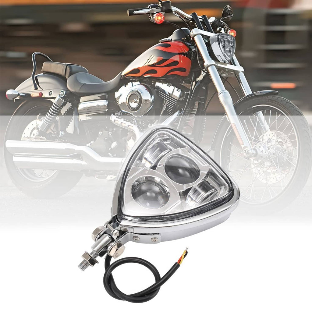 Triangular LED headlight assembly with chrome housing and black cable, shown near a motorcycle