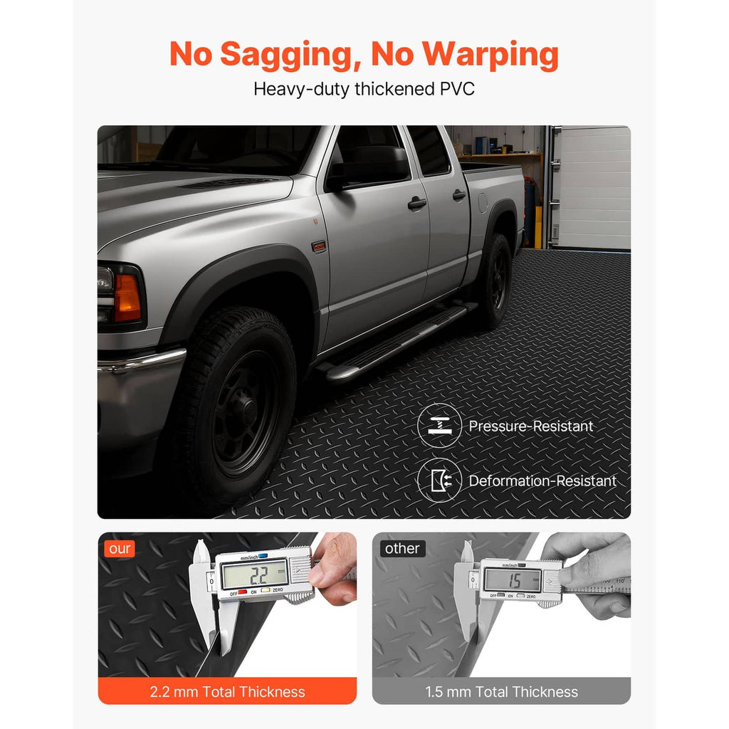 Black thick PVC garage floor mat with diamond tread pattern beside a pickup