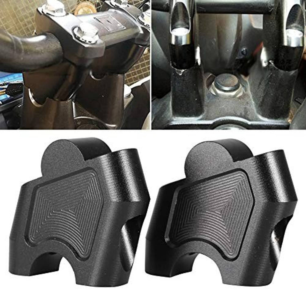 Motorcycle handlebar risers installed at the handlebar mount with hardware