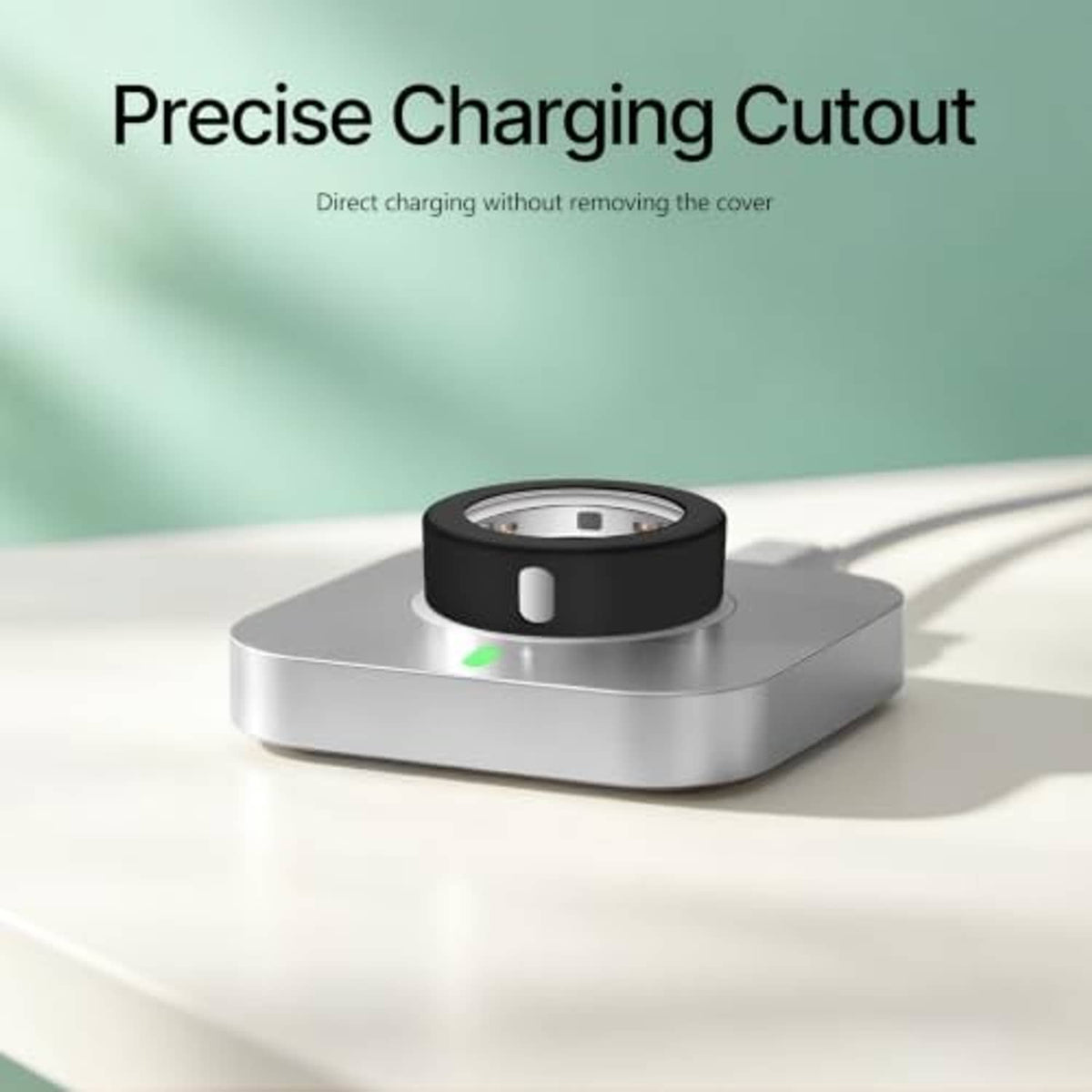 Black silicone ring cover with an exposed charging cutout on a gray base