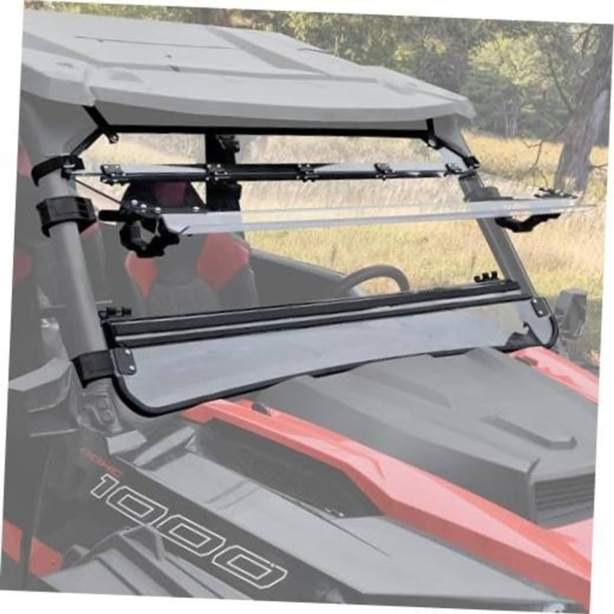 Clear flip-up windshield with black mounting frame on UTV
